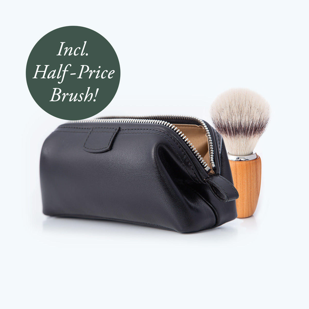 black leather wash bag with a zip opening, and a vegan friendly shaving brush