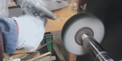 hand polishing a razor handle